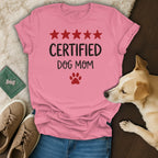 Pink t-shirt with "CERTIFIED DOG MOM" text, paw print, and red stars.