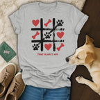 Light gray t-shirt with tic-tac-toe game graphic and "Paws Always Win" text.