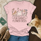 A pink t-shirt featuring three illustrated dogs, flowers, and the text Fur Babies Flower Beds.