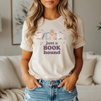 Cream t-shirt with "just a book hound" and dog graphic surrounded by books.