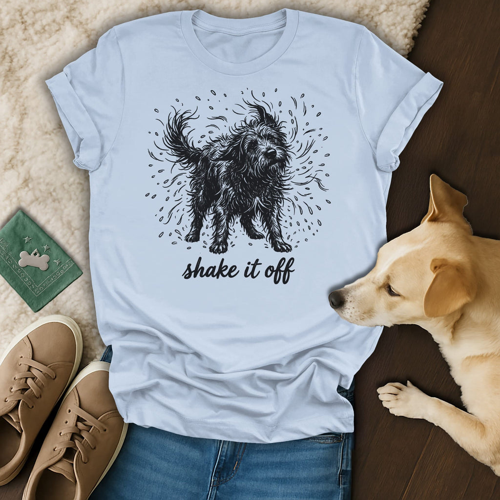Black shaggy dog illustration on a light blue t-shirt with "shake it off" text.
