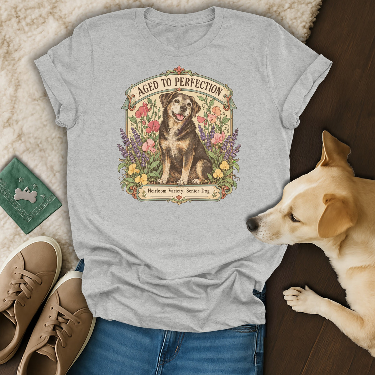 Heather gray t-shirt featuring an illustration of an older dog surrounded by flowers, with the text Aged to Perfection.