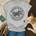 Grey t-shirt with wolf, mountains, and "Survived the Ice Age Scared of the Vacuum" text.