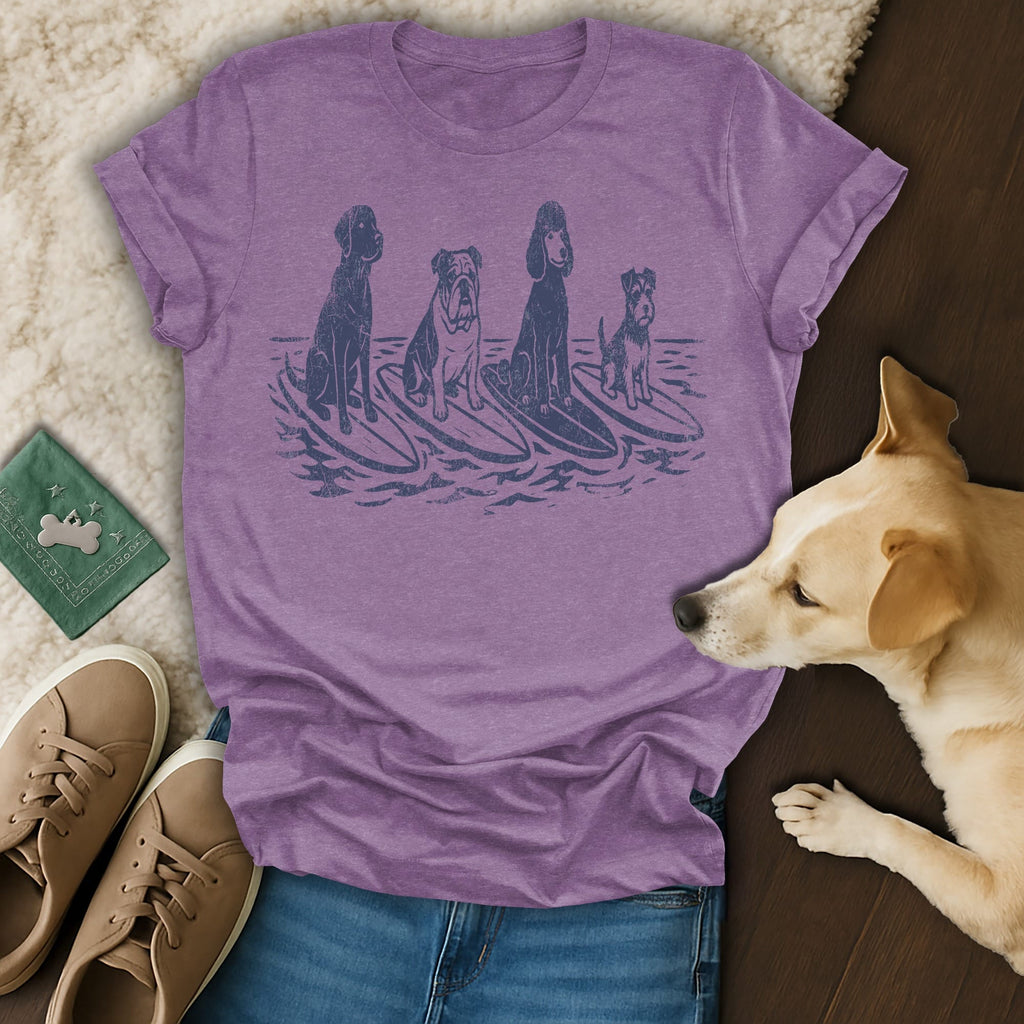 Four dogs on surfboards, screen printed on a heather purple t-shirt.