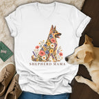 White v-neck t-shirt featuring a German Shepherd graphic made of colorful flowers with the text SHEPHERD MAMA.