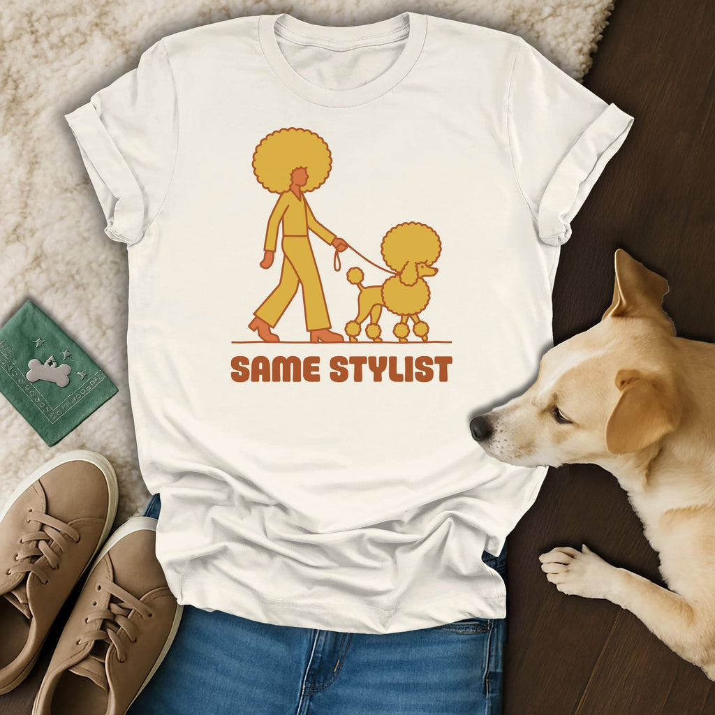 T-shirt with line art of a person walking an afro poodle, text "SAME STYLIST".