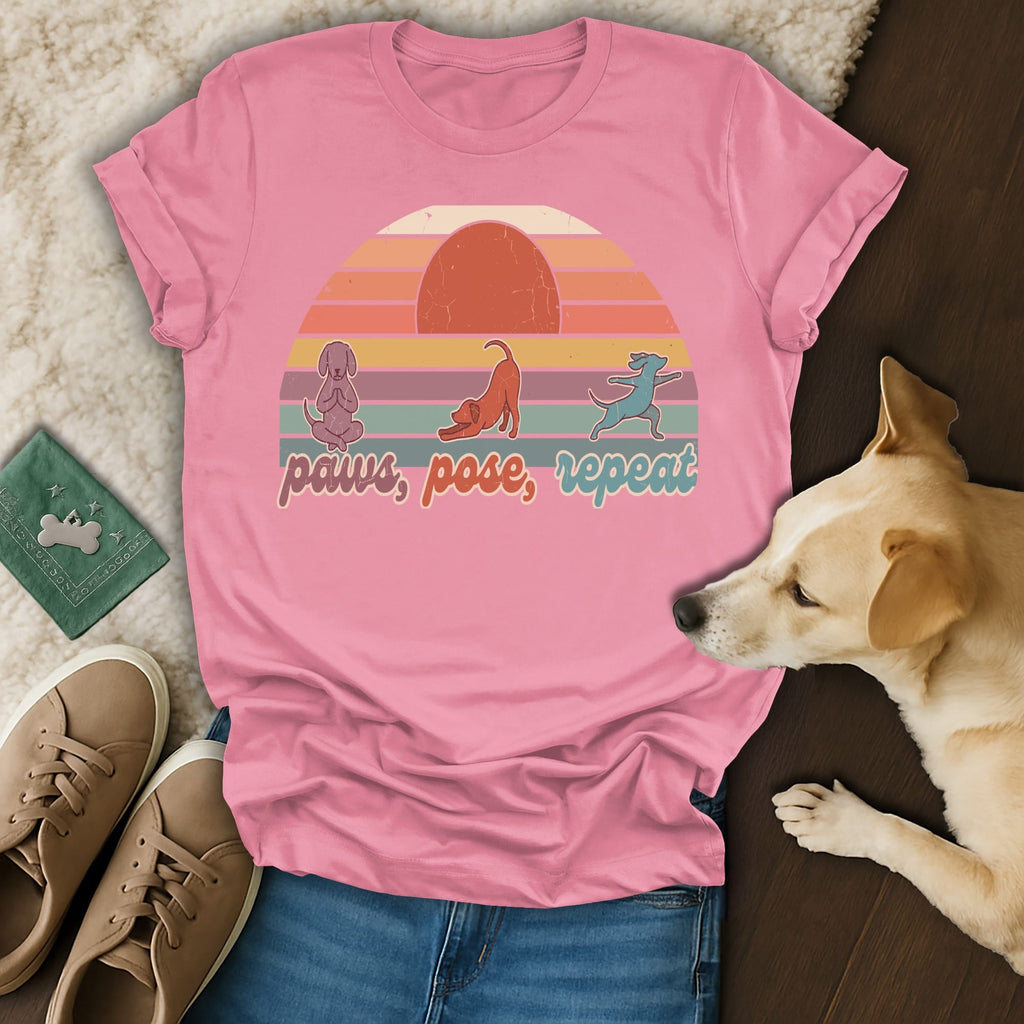 Pink t-shirt with "paws, pose, repeat" text and dog silhouettes.