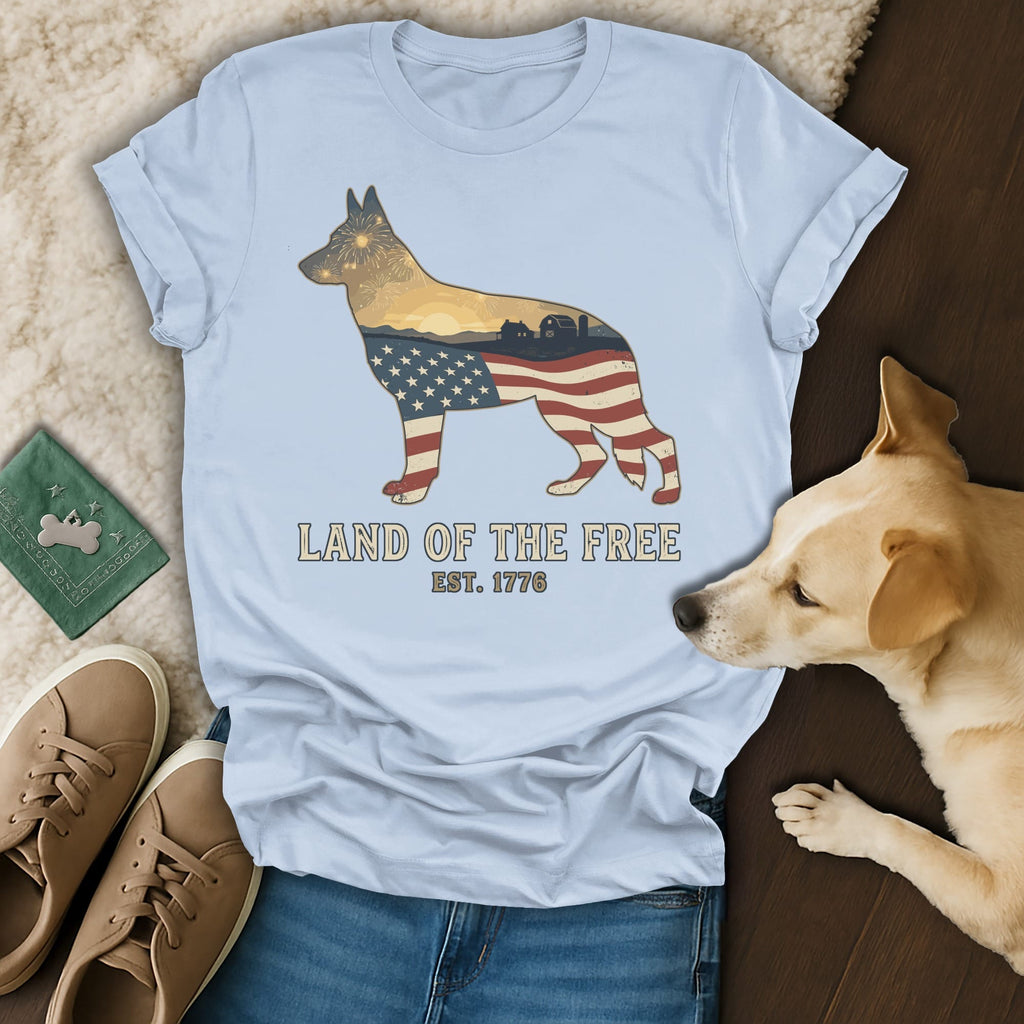 German Shepherd silhouette with American flag and landscape overlay, "Land of the Free" text.