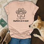 Peach t-shirt with black paw print heart logo and "Pawprints on My Heart" text.