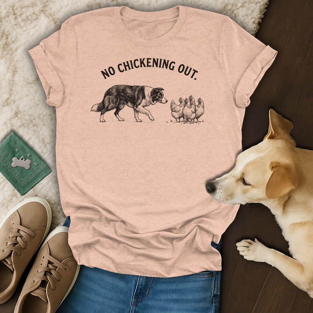 Peach t-shirt with dog and chickens illustration and text "NO CHICKENING OUT."