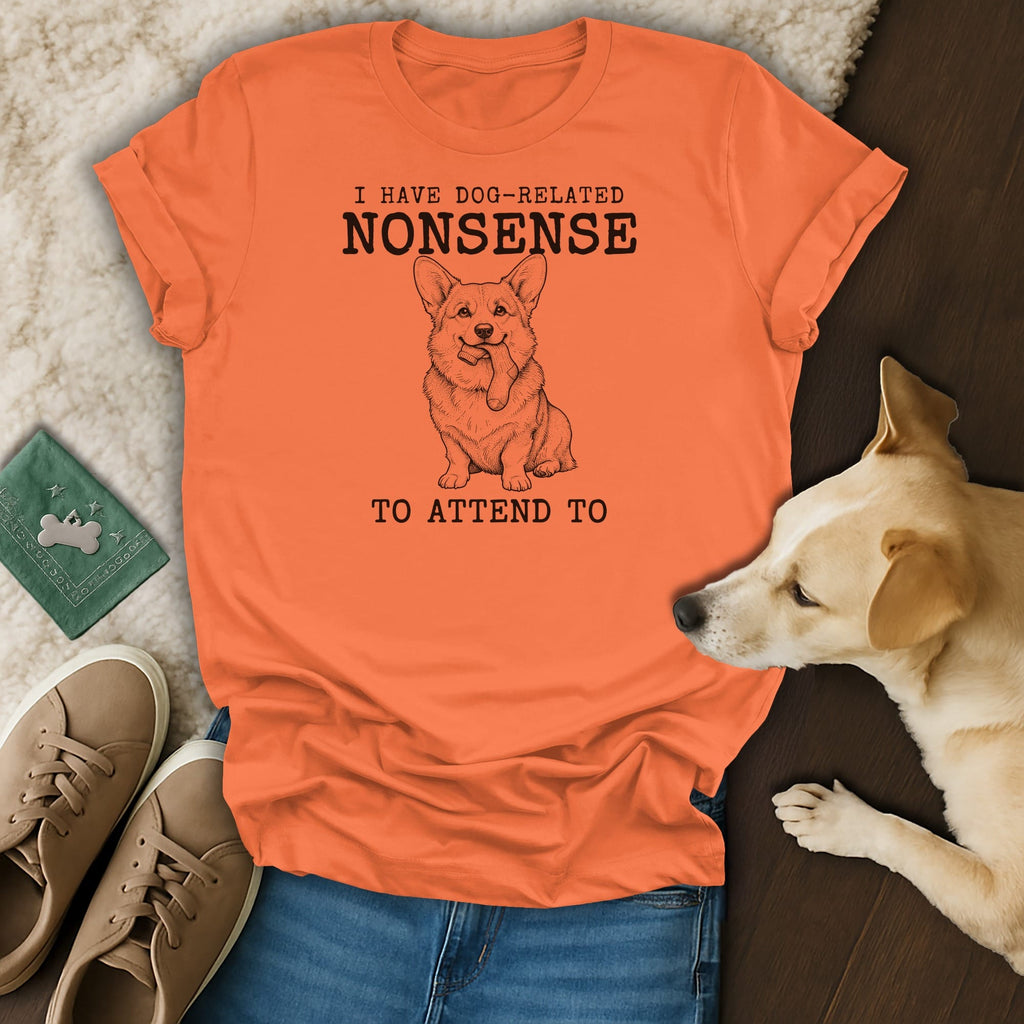 Orange t-shirt with black text and a corgi drawing: "I HAVE DOG-RELATED NONSENSE TO ATTEND TO".