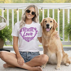Woman wearing "Rescue. Love. Repeat." t-shirt with golden retriever on porch.