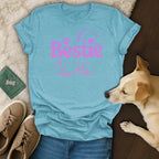 Light blue t-shirt with pink dog silhouette and "Bestie" text.