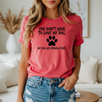 Red t-shirt with black text: "YOU DON'T HAVE TO LOVE MY DOG. MY DOG HAS ENOUGH FANS."