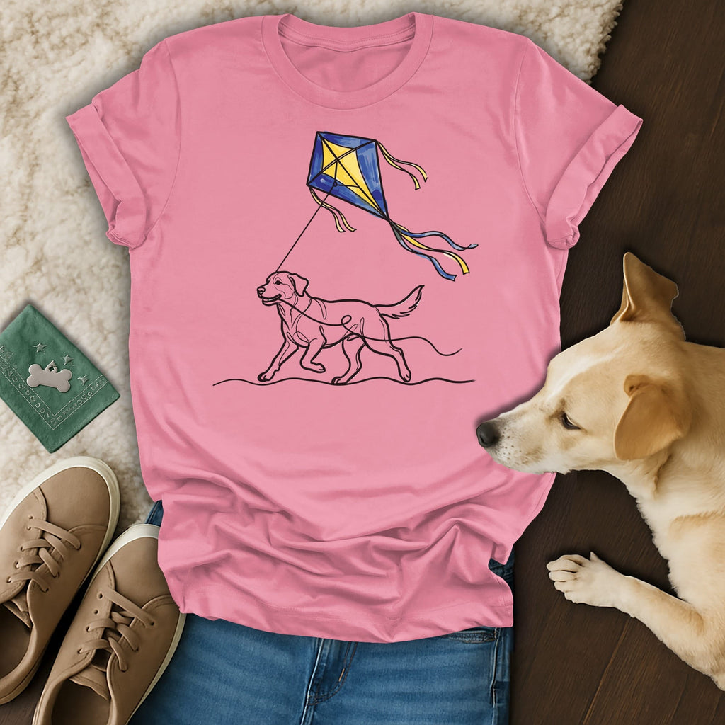 Dog pulling a kite across a pink t-shirt.