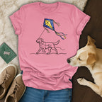Dog pulling a kite across a pink t-shirt.