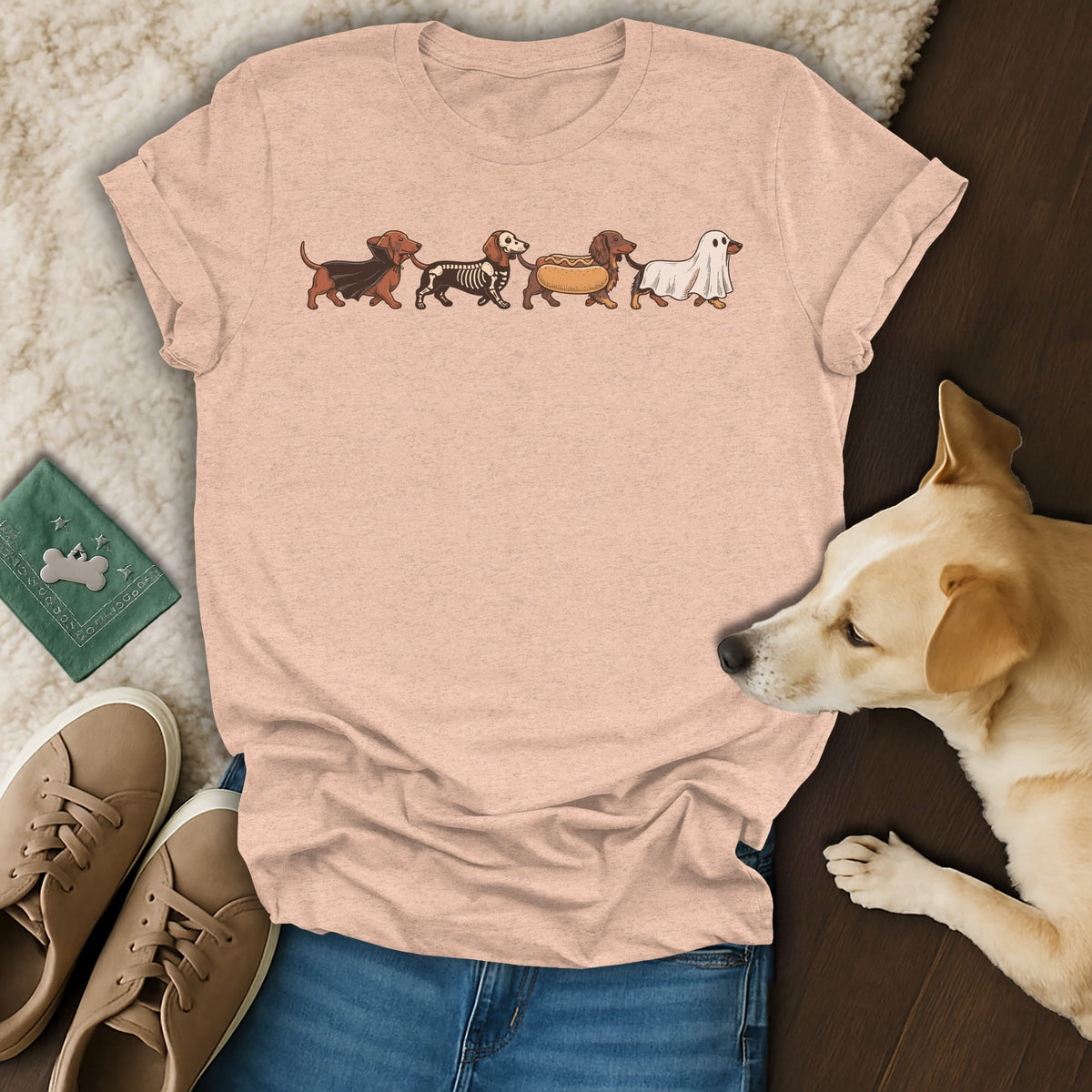 Peach t-shirt with dachshunds dressed as a vampire, skeleton, hot dog, and ghost.