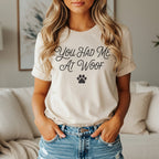 Cream t-shirt with "You Had Me At Woof" and a paw print.