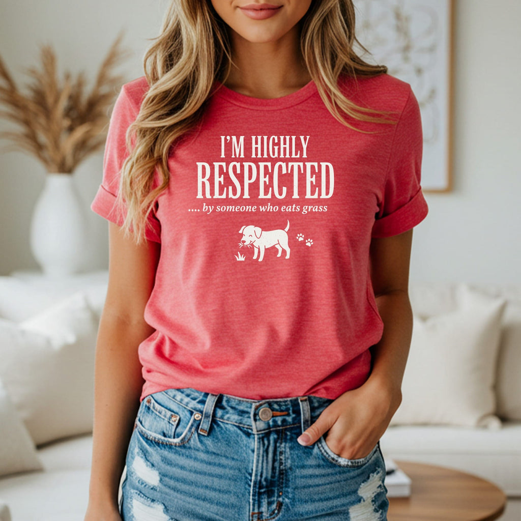 Red t-shirt with white text "I'M HIGHLY RESPECTED .... by someone who eats grass" and dog graphic.