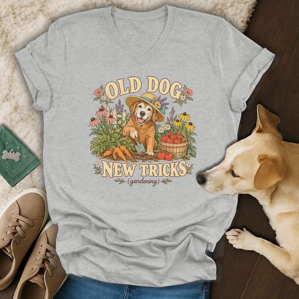Heather gray v-neck t-shirt featuring a golden retriever gardening graphic with the text OLD DOG NEW TRICKS.