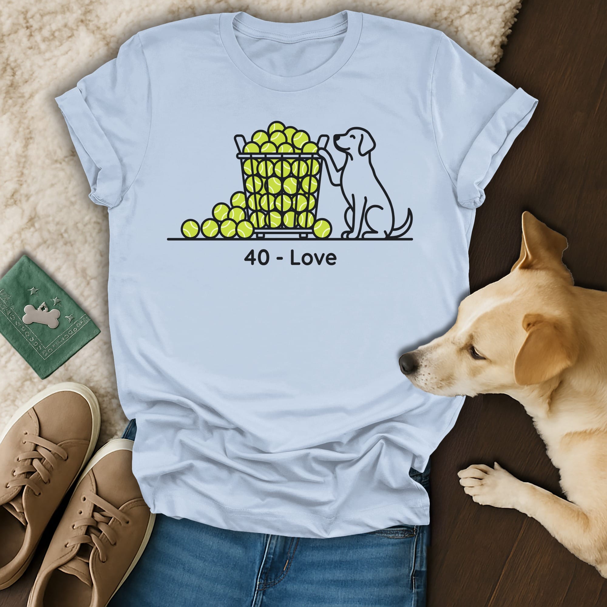 Light blue t-shirt with a dog holding a tennis ball basket, "40 - Love" text.