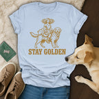 Golden retriever with a girl riding on its back, "STAY GOLDEN" text.