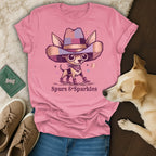 Pink t-shirt with a chihuahua wearing a cowboy hat and boots, with text "Spurs & Sparkles".