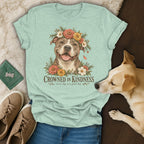 Mint green t-shirt featuring a pit bull illustration with a floral crown and the text Crowned in Kindness.
