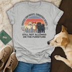 T-shirt with three dogs, text "Crossed Continents. Conquered Hearts. Still Not Allowed On The Furniture."