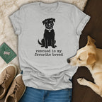 Grey t-shirt with a dog silhouette and "Rescued is my favorite breed" text.