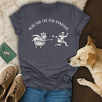 Dark grey t-shirt with "HERE FOR THE FUR-NANIGANS" and drawing of corgi in cart chasing mailman.