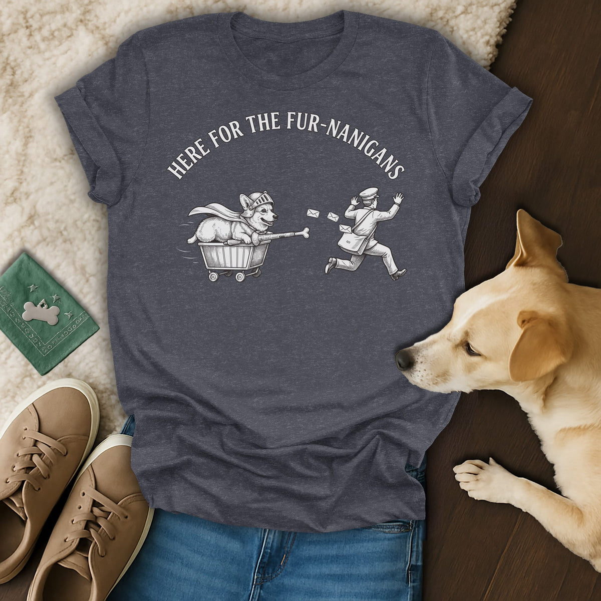 Dark grey t-shirt with "HERE FOR THE FUR-NANIGANS" and drawing of corgi in cart chasing mailman.