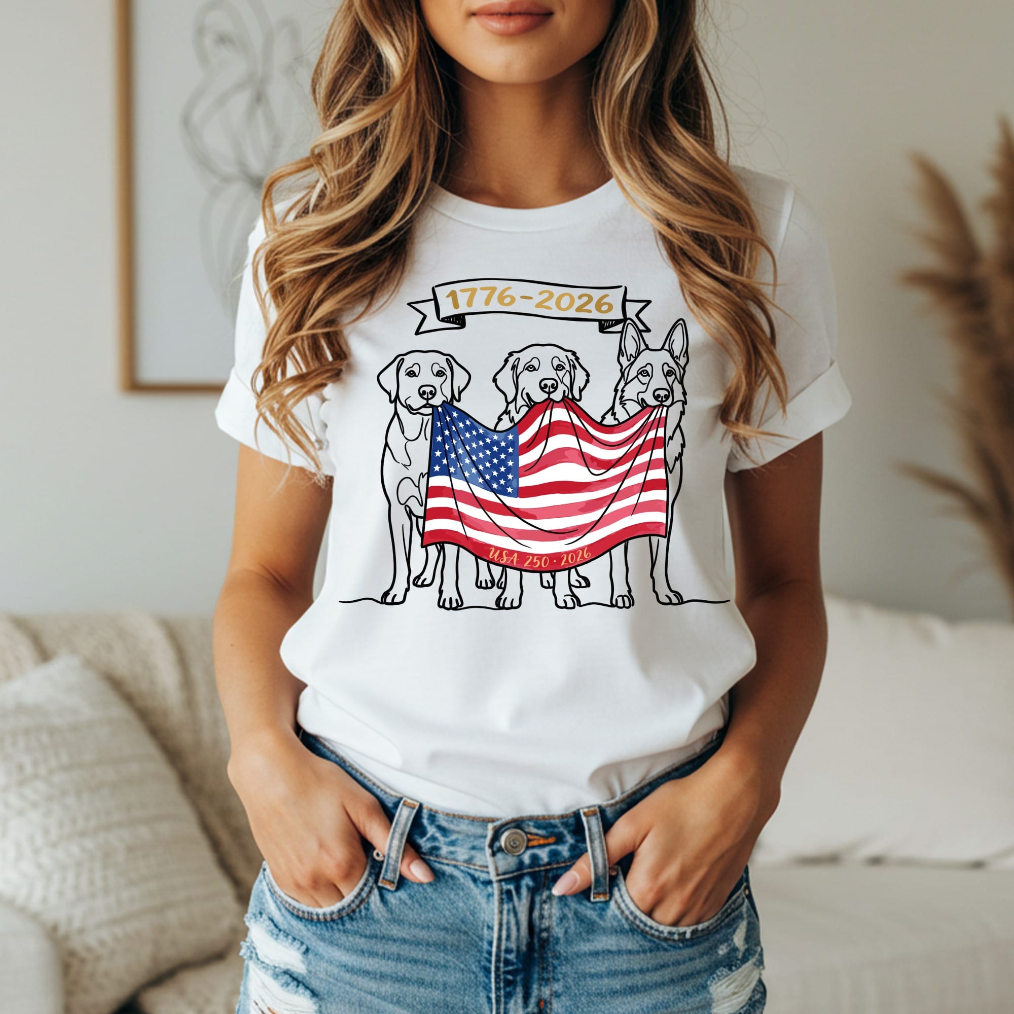 Three dogs hold an American flag banner across their mouths, reading "1776-2026".