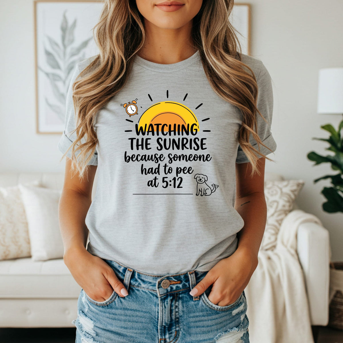 T-shirt graphic: "Watching the sunrise because someone had to pee at 5:12" with sun and dog.