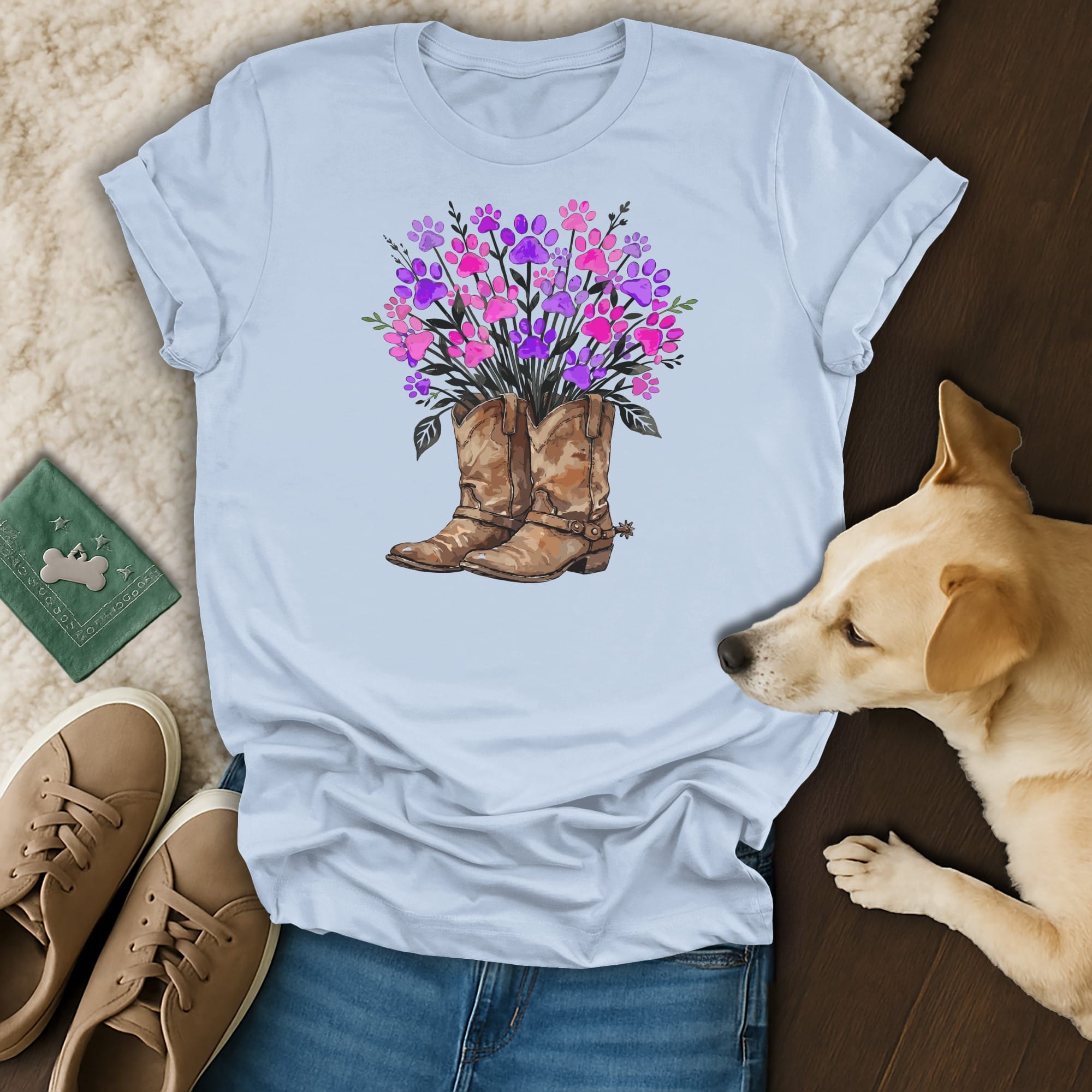 Light blue t-shirt with brown cowboy boots and a floral bouquet.