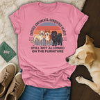 Pink t-shirt with dogs and text "Crossed Continents. Conquered Hearts. Still Not Allowed On The Furniture."
