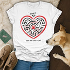 White t-shirt with heart maze featuring paw prints and text "START"