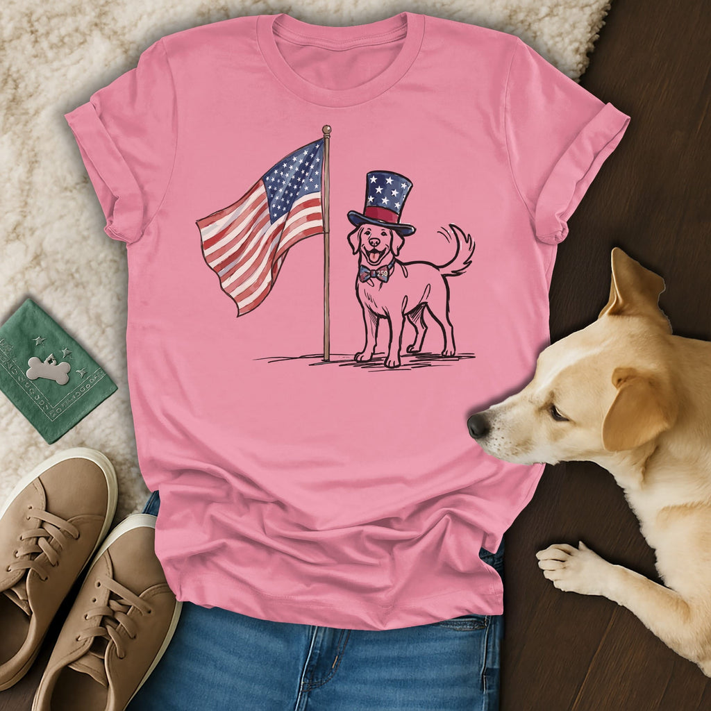 Dog wearing a top hat stands by an American flag on a pink t-shirt.