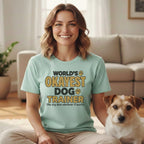 Light blue t-shirt with "WORLD'S OKAYEST DOG TRAINER" text and a dog.