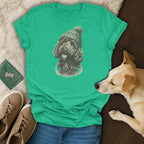 Green t-shirt with a doodle dog wearing a knitted hat and scarf graphic.