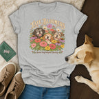 A light gray t-shirt with three smiling dogs surrounded by colorful flowers and the text Late Bloomers Senior Dog Adoption Society.