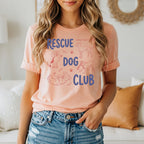 Peach t-shirt with "RESCUE DOG CLUB" text and illustrations of dogs.