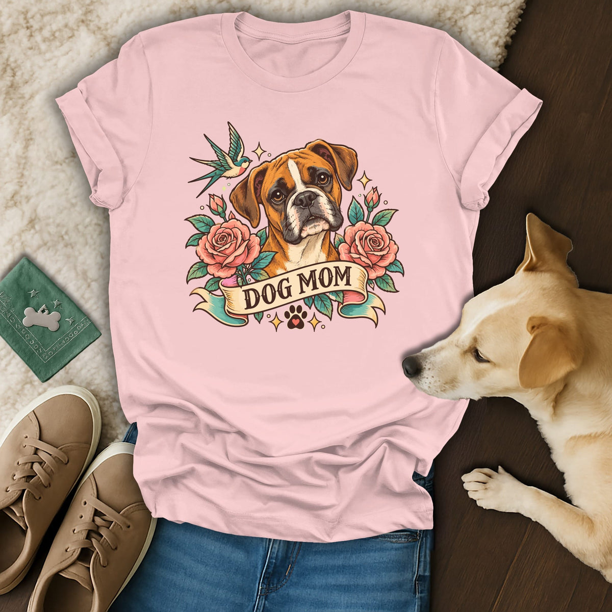 A light pink t-shirt with a tattoo-style Boxer dog graphic and the text DOG MOM.