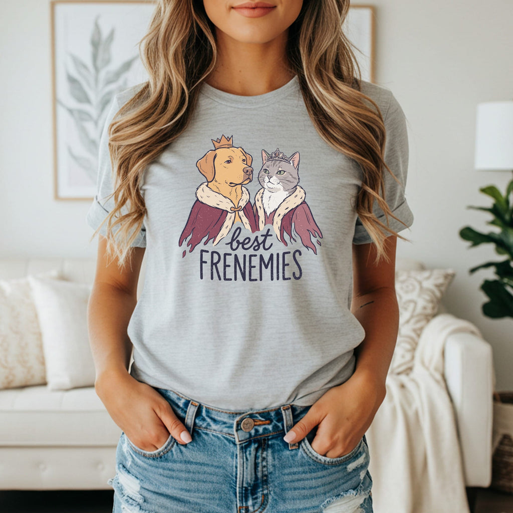Dog and cat wearing crowns and robes with text "best FRENEMIES"