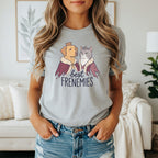Dog and cat wearing crowns and robes with text "best FRENEMIES"