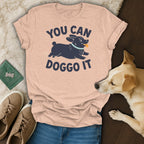 Peach t-shirt with dark blue text "YOU CAN DOGGO IT" and a cartoon dog.