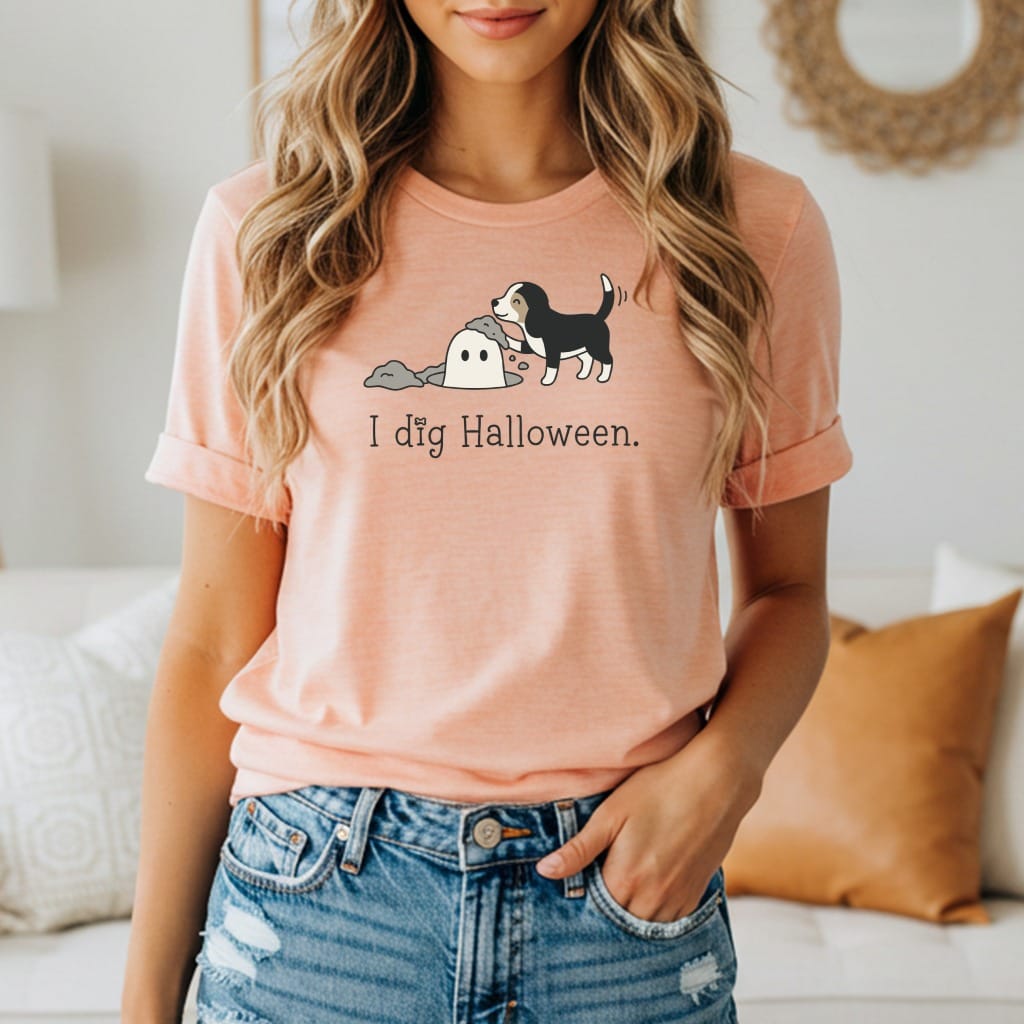 Peach t-shirt with cartoon dog digging ghost and text "I dig Halloween."