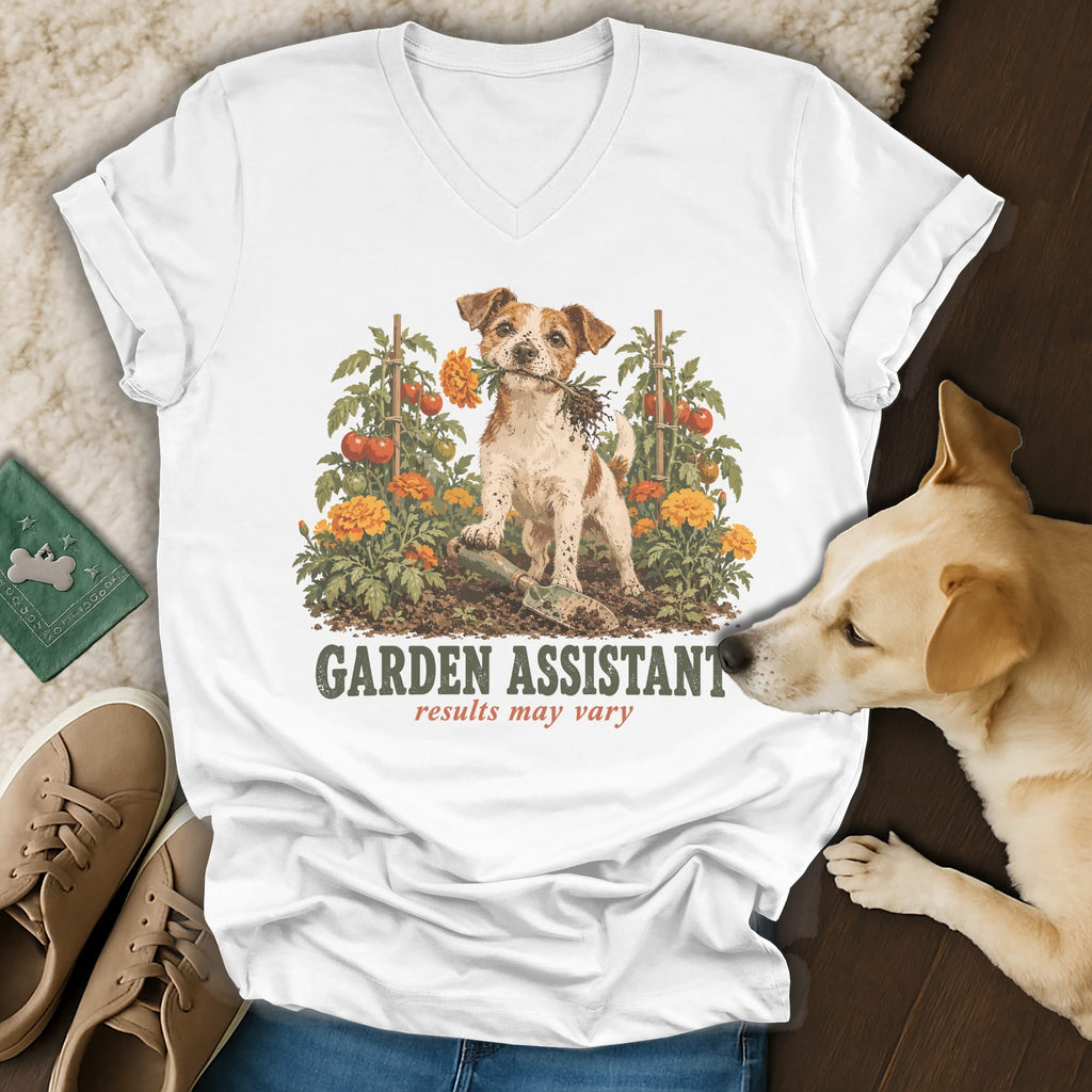 A white V-neck t-shirt featuring a graphic of a dog in a garden with the text GARDEN ASSISTANT results may vary.