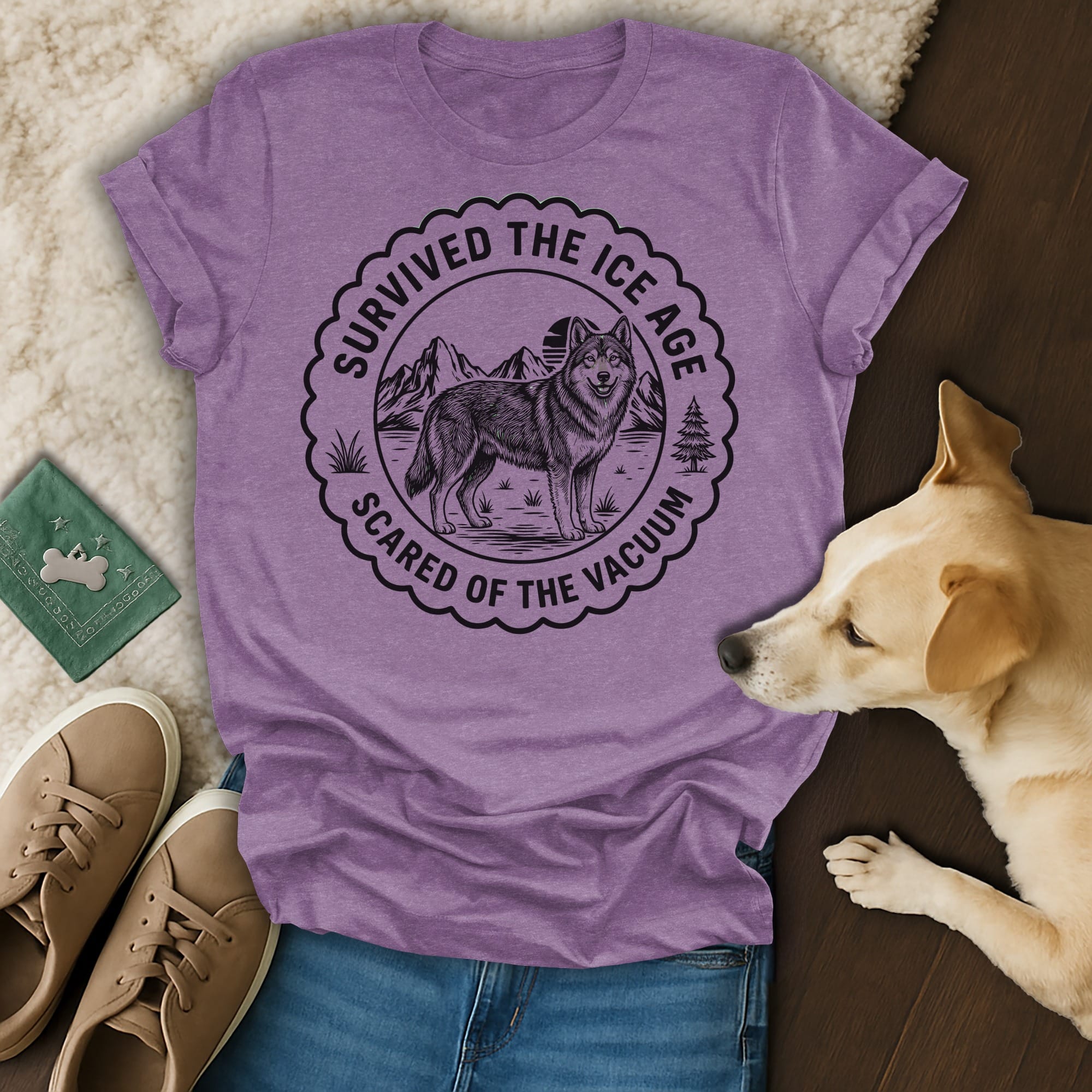 T-shirt with a wolf and mountain graphic, text "Survived the Ice Age Scared of the Vacuum".