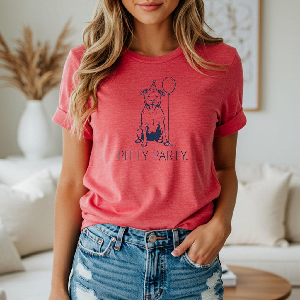 T-shirt with a line drawing of a pit bull wearing a party hat and holding a balloon.